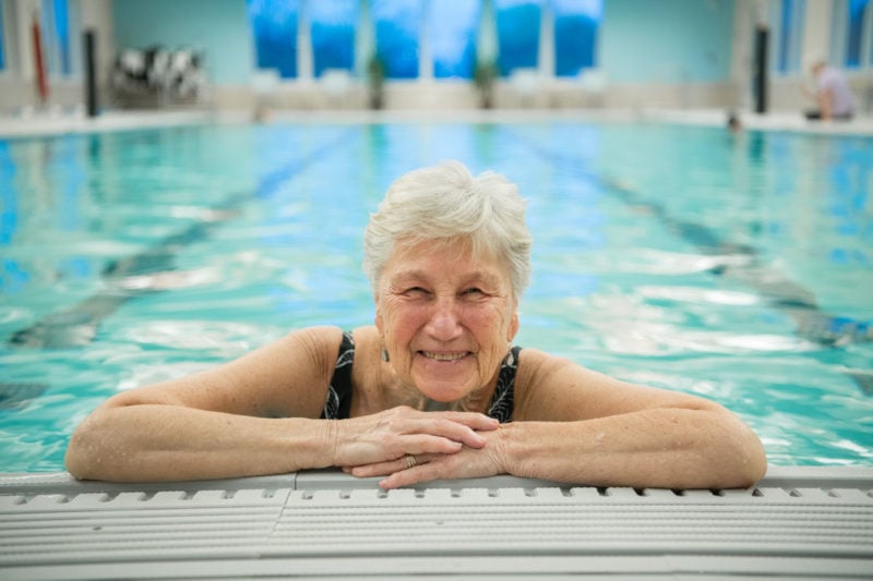 senior woman smiling in the pool