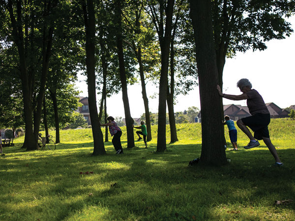 Landis Homes woman stretching in trees