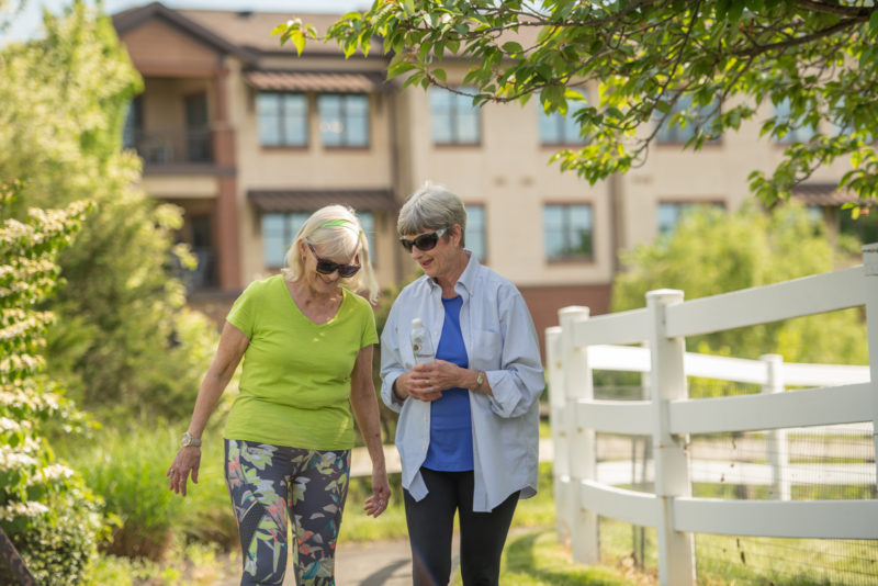 Two female residents walking outside