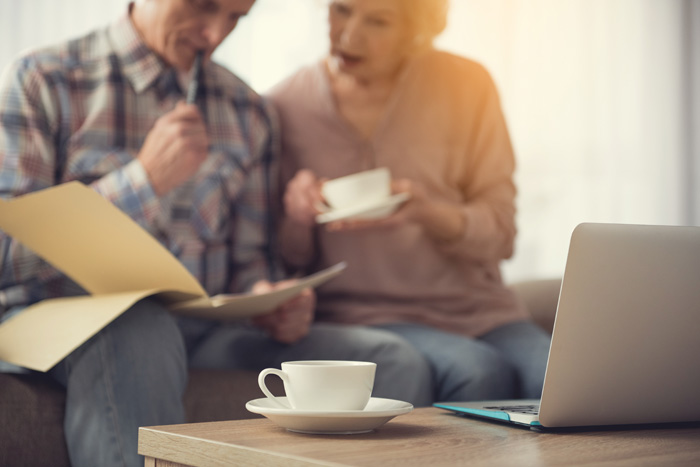 Two residents looking through papers