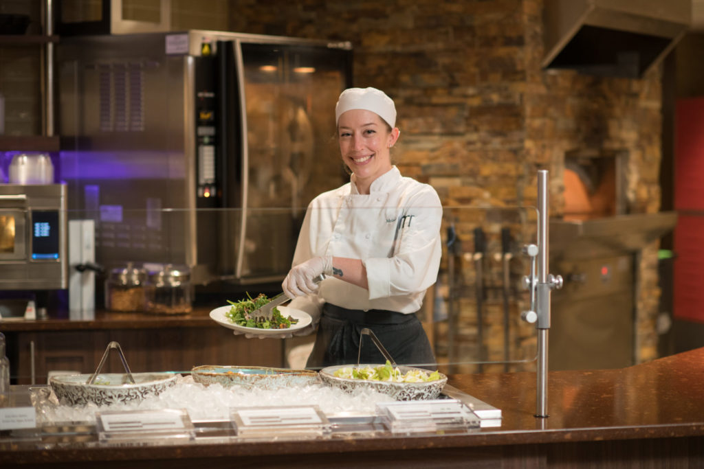 Chef serving salad